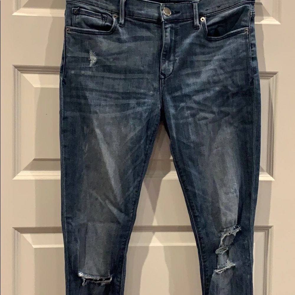 Jean legging, mid rise, lightly distressed.